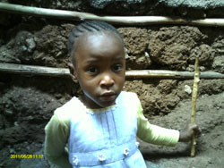 Little girl playing in Kibera